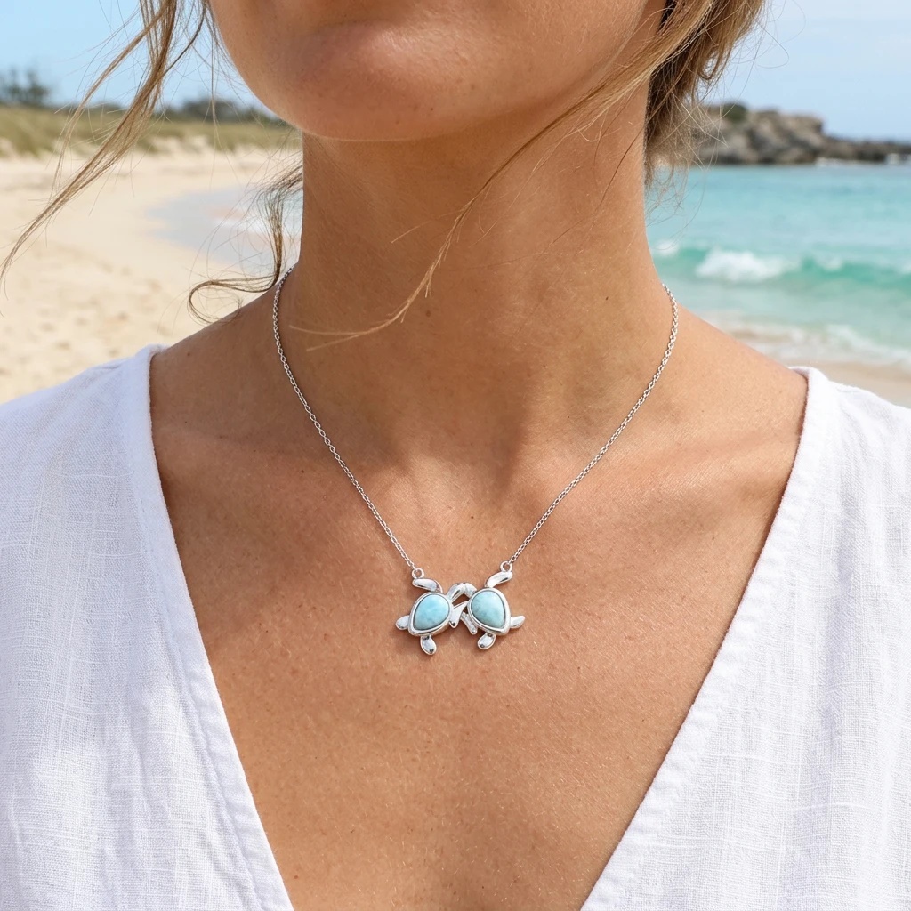 Two turtle Larimar necklace worn by the water